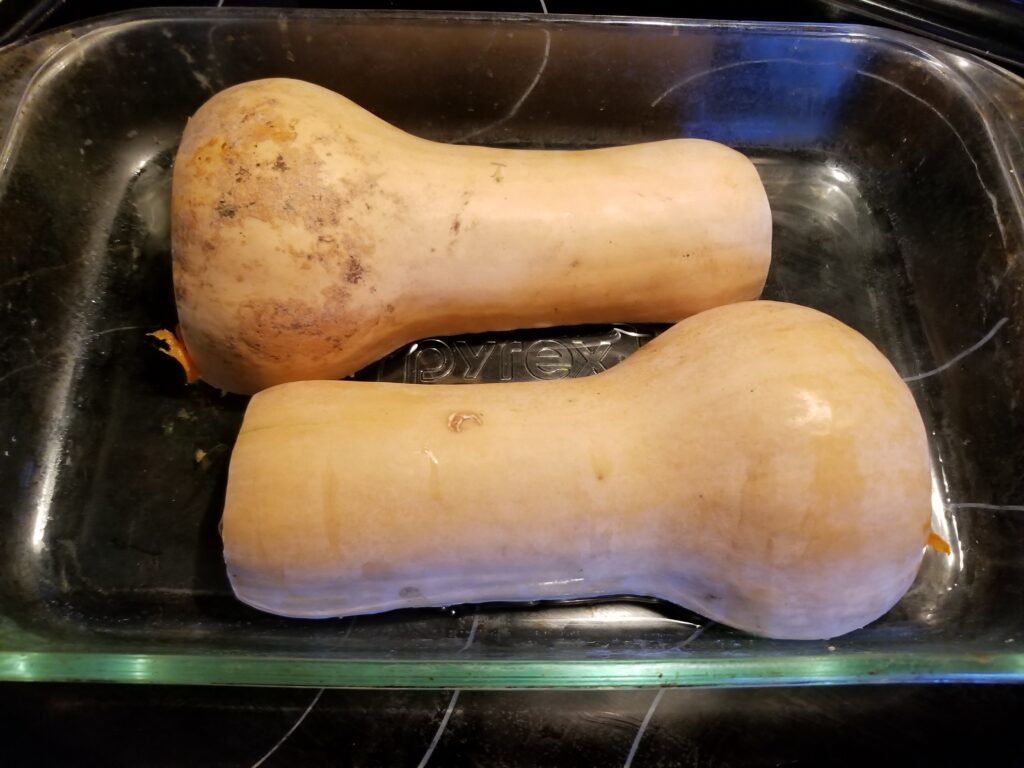 Squash with flat sides facing down in glass dish. 